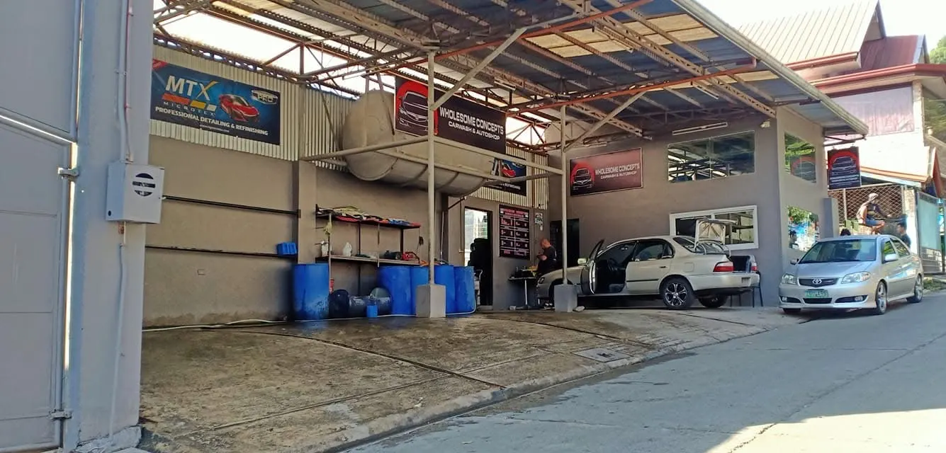 Front of the Wholesome Concepts Carwash & Autoshop on Amistad Road